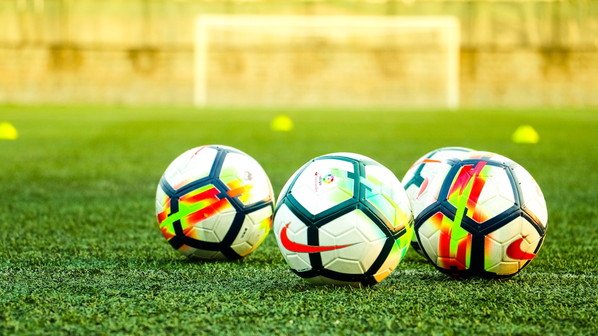 Footballer guiding the ball during open play